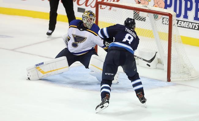 Trevor Hagan / THE CANADIAN PRESS
Winnipeg Jets' Jacob Trouba scores the game-winning goal on St. Louis Blues goaltender Jake Allen during overtime in Winnipeg, Monday.