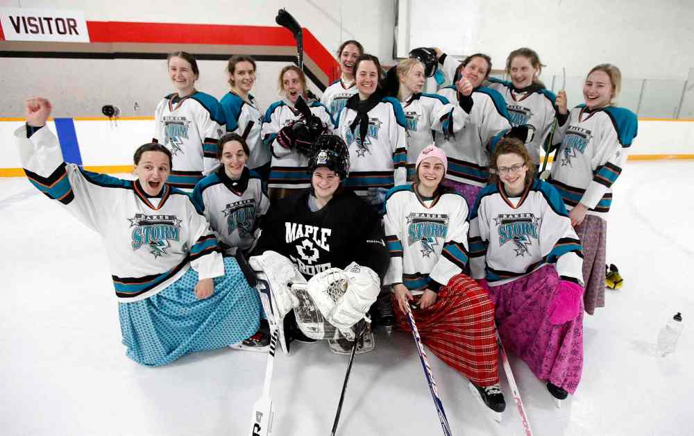 The Baker Storm pose for a team photo after playing the Iron Maidens in MacGregor for the 9th annual charity game. (Phil Hossack / Winnipeg Free Press)