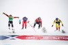 Daniel Bohnacker, wearing yellow top, of Germany crosses the finish line to win followed by Kevin Drury, red, second from right,  of Canada, Ryan Regez, blue, of Switzerland and Brady Leman, green, of Canada in action during the FIS World Cup Men's Freestyle Skicross final in Idre, Sweden, on Sunday Jan. 26, 2020. (Pontus Lundahl / TT via AP)