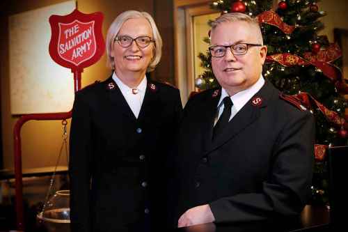 Maj. Brenda Critch and Maj. Shawn Critch humbly downplay a suggestion they are the unsung heroes of the holiday season. (John Woods / Winnipeg Free Press)