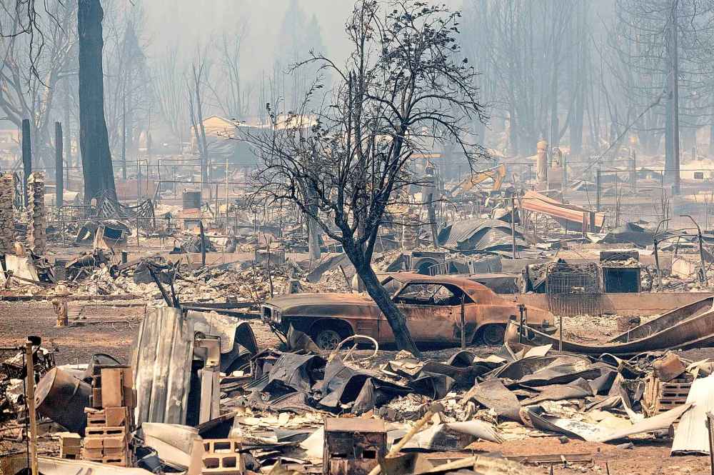 CP
Homes and cars destroyed by the Dixie Fire line central Greenville on Thursday, Aug. 5, 2021, in Plumas County, Calif. (AP Photo/Noah Berger)