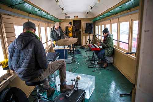 Michael Jordan (left), Matt Peters, Bucky Driedger and Matt Schellenberg of Royal Canoe test out their ice instruments at The Forks. (Mikaela MacKenzie / Winnipeg Free Press)