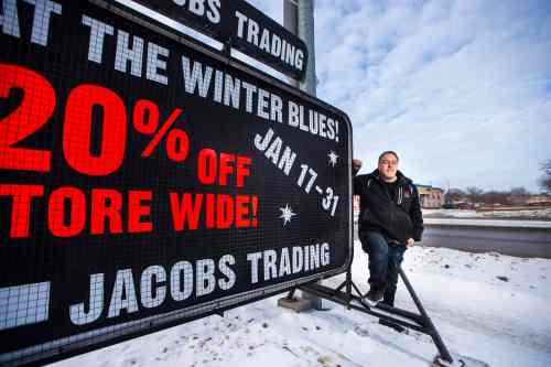 MIKAELA MACKENZIE / WINNIPEG FREE PRESS

Brad Ingles, owner of a mobile sign company, poses for a portrait by one of his signs on Regent Avenue in Winnipeg on Wednesday, Jan. 29, 2020. The city has suggested new regulations for mobile signs that industry says does nothing to enhance public safety or to promote a strong viable business community. For Danielle Da Silva story.
Winnipeg Free Press 2019.