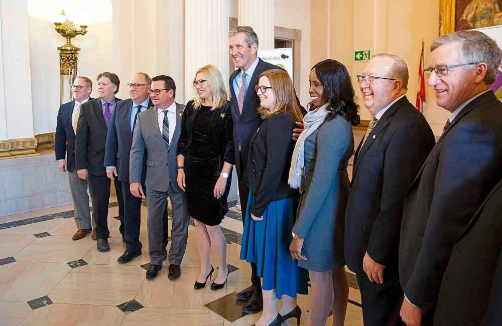 Premier Brian Pallister and his cabinet were all smiles during Thursday's announcement. (Mike Deal / Winnipeg Free Press)