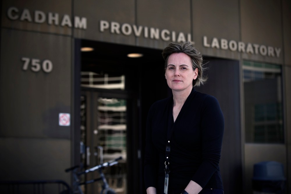 Dr Kerry Dust, virologist at Cadham Provincial Laboratory, says the lab is sometimes conducting more than 800 tests a day. (John Woods / Winnipeg Free Press)