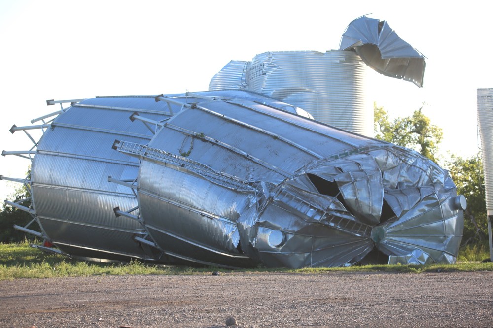 Kyle Darbyson/The Brandon Sun
One of Giovanni Colangelo's grain bins lies on its side Saturday morning after a powerful tornado blew through his Scarth-area farm Friday night.