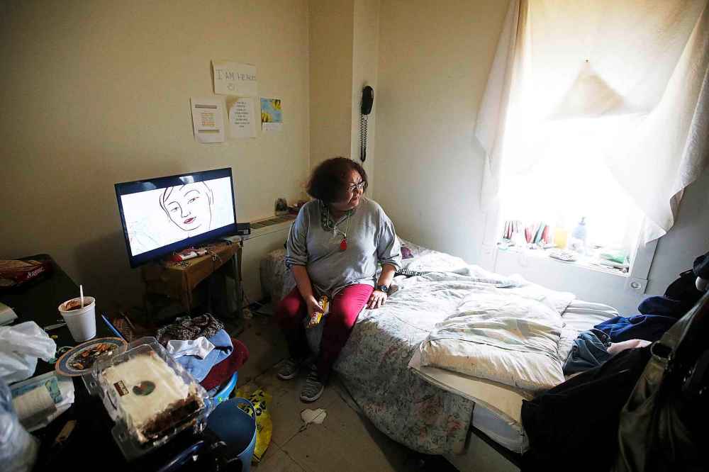 Ramona in her room at the Bell Hotel. All the suites are single-occupancy with a personal bathroom and kitchenette.
