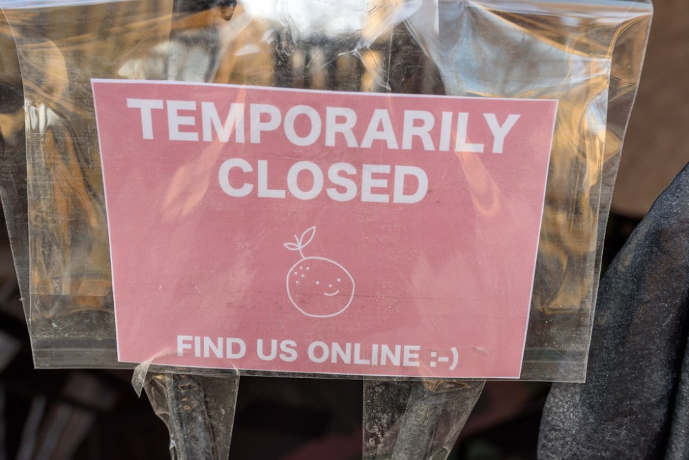Signs like this one at Corydon Avenue shop Riley Grae are a regular sight throughout the province. (Jesse Boily / Winnipeg Free Press files)