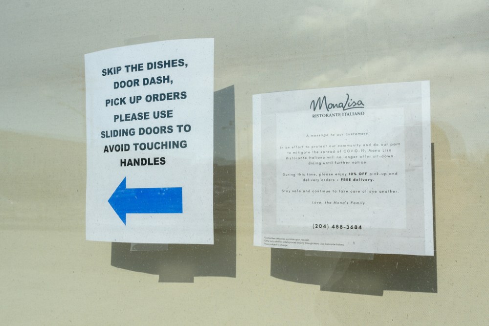 Signs of the times at Mona Lisa. (Jesse Boily / Winnipeg Free Press)