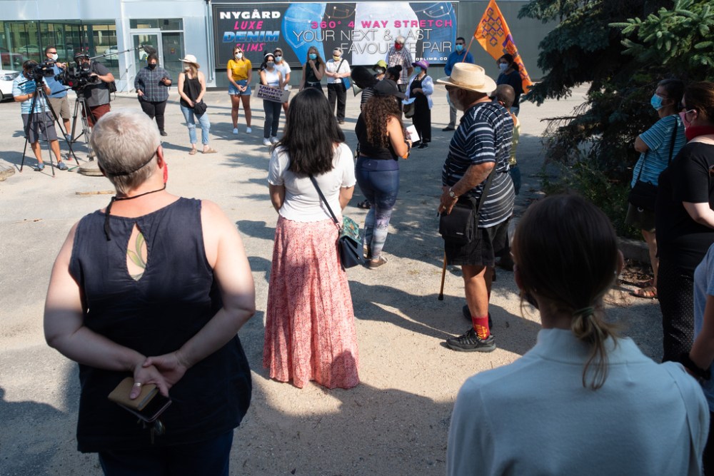 People gathered to bring awareness to what they say is Peter Nygard’s legacy of sexual abuse outside of Peter Nygard’s Notre Dame property on Wednesday. (Jesse Boily / Winnipeg Free Press)