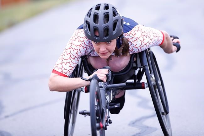 Leanne Taylor, team Canada para-triathlete, trains on her racing wheelchair in Oak Bluff, Manitoba, Wednesday, September 30, 2020. Taylor received funds from Canadian rower Silken Laumann to help purchase competitive equipment. THE CANADIAN PRESS/John Woods