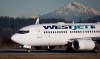 A pilot taxis a WestJet Boeing 737-700 plane to a gate after arriving at Vancouver International Airport in Richmond, B.C., on February 3, 2014. THE CANADIAN PRESS/Darryl Dyck