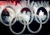 A snowboarder flies through the Olympic rings at the beginning of the opening ceremonies for the XXI Olympic Winter Games in Vancouver, Friday, Feb. 12, 2009. Vancouver's council is considering taking the first small steps toward another Olympic bid. THE CANADIAN PRESS/Nathan Denette