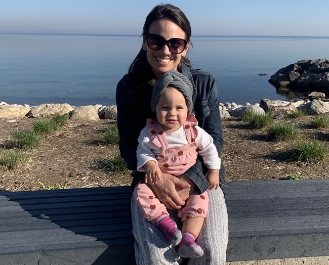 Retired figure skater Meagan Duhamel and her daughter Zoey are shown in this November handout image in Burlington, Ontario. Duhamel noticed a small sign by a family room door while staying with her baby daughter in the neonatal intensive care unit at Oakville Trafalgar Memorial Hospital last fall. It read: