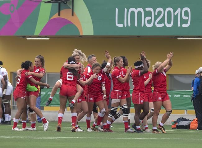 Canada's women's rugby sevens team celebrate after defeating the United States to win the gold medal at the Pan Am Games in Lima, Peru on Sunday, July 28, 2019. Eight Canadian teams had qualified for the 2020 Tokyo Summer Olympics when the Games scheduled to start July 24 were postponed to 2021 because of the COVID-19 virus. THE CANADIAN PRESS/Andrew Vaughan