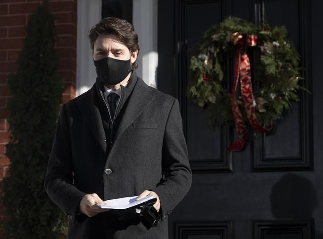 Prime Minister Justin Trudeau walk to the podium for a news conference outside of Rideau Cottage in Ottawa, Tuesday November 24, 2020. THE CANADIAN PRESS/Adrian Wyld
