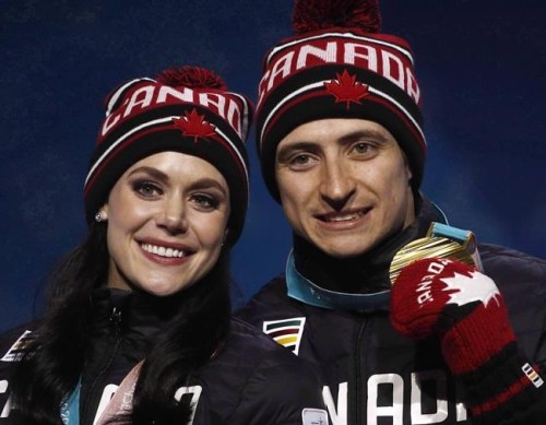 Gold medallists in the ice dance, free dance figure skating Tessa Virtue and Scott Moir, of Canada, pose during their medals ceremony at the 2018 Winter Olympics in Pyeongchang, South Korea, Tuesday, Feb. 20, 2018. THE CANADIAN PRESS/AP-Charlie Riedel