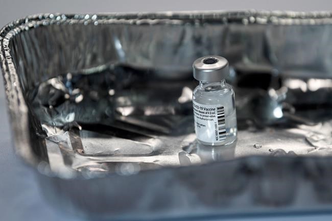 A vial of the Pfizer-BioNTech COVID-19 vaccine, as the mass public vaccination program gets underway, at the NHS Louisa Jordan Hospital in Glasgow, Scotland, Tuesday Dec. 8, 2020. The federal government says the largest mass immunization effort in Canadian history could begin as early as next week. THE CANADIAN PRESS/AP-POOL, Jeff J Mitchell