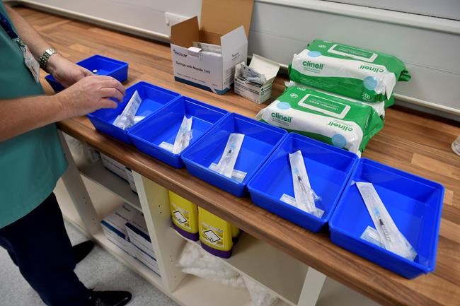 The Pfizer-BioNTech COVID-19 vaccines are prepared at a vaccination centre in Cardiff, Wales, Tuesday Dec. 8, 2020. THE CANADIAN PRESS/AP-POOL, Ben Birchall