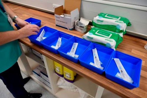 The Pfizer-BioNTech COVID-19 vaccines are prepared at a vaccination centre in Cardiff, Wales, Tuesday Dec. 8, 2020. THE CANADIAN PRESS/AP-POOL, Ben Birchall