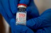 Michelle Chester, director of employee health services at Northwell Health, holds a bottle containing the Moderna COVID-19 vaccine at Northwell Health's Long Island Jewish Valley Stream hospital in Valley Stream, N.Y., on Monday, Dec. 21, 2020. THE CANADIAN PRESS/Eduardo Munoz/Pool via AP