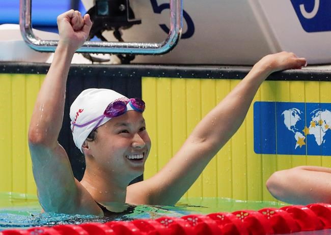 Canada's Margaret Mac Neil reacts after winning the women's 100m butterfly final at the World Swimming Championships in Gwangju, South Korea, Monday, July 22, 2019. When COVID-19 shut down the NCAA swimming season last March, Margaret Mac Neil packed up her car and drove home to London, Ont., from the University of Michigan. In the whirlwind days that followed, Canada announced it wouldn't compete in the 2020 Tokyo Olympic and Paralympic Games if they were held as scheduled. The Games were eventually postponed to 2021. THE CANADIAN PRESS/AP, Lee Jin-man