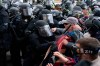 Capitol police officers in riot gear push back demonstrators who try to break a door of the U.S. Capitol on Wednesday, Jan. 6, 2021, in Washington. Prime Minister Justin Trudeau is again condemning violent rioters he says were incited by U.S. President Donald Trump and other politicians on Capitol Hill this week. THE CANADIAN PRESS/AP/Jose Luis Magana