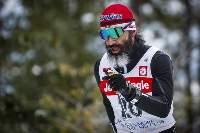 Canadian Cross-Country Ski Team member Brian McKeever skis up a hill during early season training in Canmore, Alta., Monday, Oct. 19, 2020. McKeever, a 13-time Paralympic champion, is testing wax for young Canadian racers at this week's world junior and under-23 championship in Vuokatti, Finland. THE CANADIAN PRESS/Jeff McIntosh
