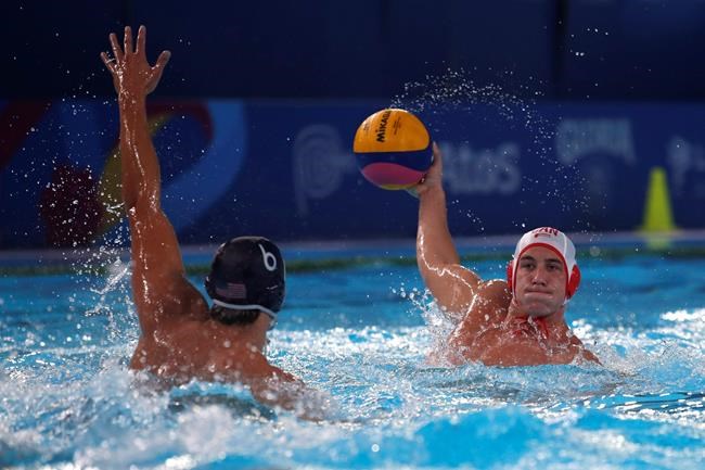 Canada's Jeremie Cote, right, is challenged by United States' Luca Cupido, during the men's water polo final game at the Pan American Games in Lima, Peru, Saturday, Aug. 10, 2019. THE CANADIAN PRESS/AP-Moises Castillo
