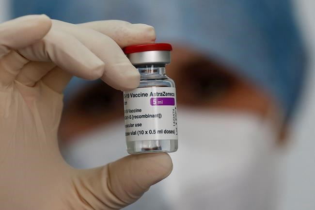A health worker holds up a dose of the AstraZeneca vaccine against COVID-19 in Rome, Tuesday, Feb. 23, 2020. (Cecilia Fabiano/LaPresse via the Associated Press)