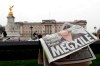 A newspaper is blown by the wind after it is placed on a railing by a television crew outside Buckingham Palace in London, Monday, March 8, 2021. Britain's royal family is absorbing the tremors from a sensational television interview by Prince Harry and the Duchess of Sussex, in which the couple said they encountered racist attitudes and a lack of support that drove Meghan to thoughts of suicide. THE CANADIAN PRESS/AP, Kirsty Wigglesworth