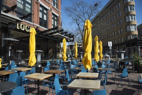 An empty patio is seen on St. Patrick's Day in Gastown in downtown Vancouver Tuesday, March 17, 2020. THE CANADIAN PRESS/Jonathan Hayward