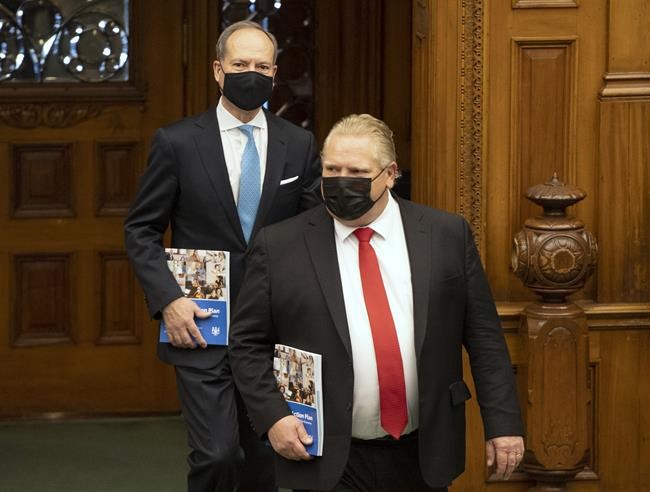 Ontario Premier Doug Ford and Finance Minister Peter Bethlenfalvy arrive in the Legislature in Toronto, Wednesday March 24, 2021. THE CANADIAN PRESS/Frank Gunn