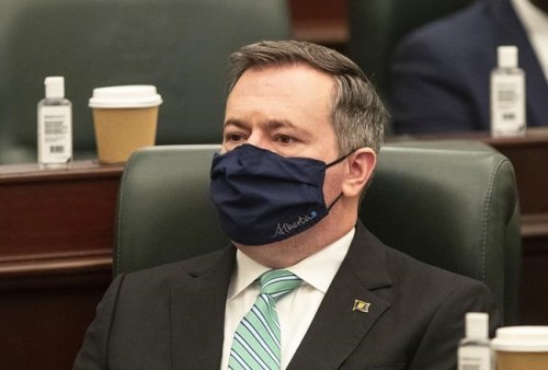 Alberta Premier Jason Kenney listens as the 2021 budget is delivered in Edmonton Alta, Thursday, February 25, 2021. Alberta Premier Jason Kenney says he hopes the Supreme Court decision upholding Ottawa’s right to levy the carbon tax doesn’t open the door to federal overreach in other areas. THE CANADIAN PRESS/Jason Franson