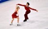 Piper Gilles and Paul Poirier of Canada perform during the Ice Dance-Free Dance at the Figure Skating World Championships in Stockholm, Sweden, Saturday, March 27, 2021. (AP Photo/Martin Meissner)