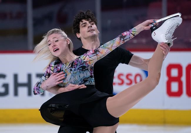 Canadian ice dancers Piper Gilles and Paul Poirier perform their routine during a practice in Montreal, on Monday, February 24, 2020. THE CANADIAN PRESS/Paul Chiasson