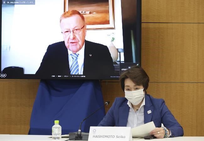 Intrernational Olympic Committee (IOC vice president John Coates speaks on a screen while Tokyo 2020 Olympics organizing committee president Seiko Hashimoto listens at a meeting of the IOC Coordination Commission for the Tokyo 2020 Olympics in Tokyo on Wednesday, May 19, 2021. IOC president Thomas Bach, Hashimoto, Japanese Olympic Minister Tamayo Marukawa and Tokyo Gov. Yuriko Koike attended a three-day meeting. (Yoshikazu Tsuno/Pool Photo via AP)