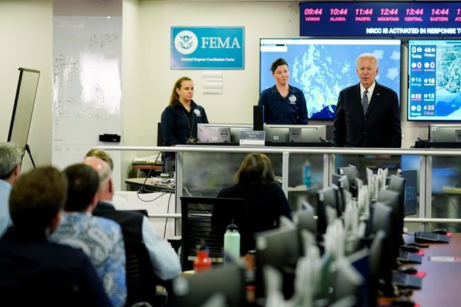 President Joe Biden talks to employees at FEMA headquarters, Monday, May 24, 2021, in Washington. (AP Photo/Evan Vucci)