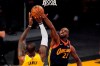Los Angeles Lakers forward LeBron James, left, has his shot blocked by Golden State Warriors forward Andrew Wiggins during the first half of an NBA basketball Western Conference Play-In game Wednesday, May 19, 2021, in Los Angeles. THE CANADIAN PRESS/AP/Mark J. Terrill