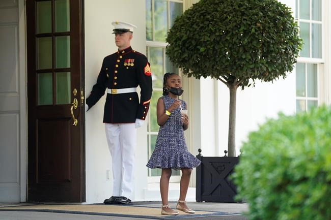 Gianna Floyd, the daughter of George Floyd, walks out of the West Wing door at the White House, Tuesday, May 25, 2021, in Washington. (AP Photo/Evan Vucci)