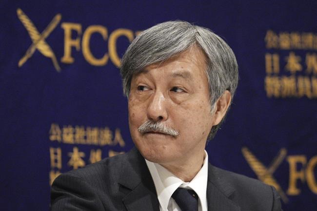 Dr. Naoto Ueyama, chairman of Japan Doctors Union, attends a press conference Thursday, May 27, 2021, in Tokyo. Dr. Ueyama warned Thursday that holding the one-year-delayed Tokyo Olympics in two months could lead to the spread of mutant variants of the coronavirus. (AP Photo/Eugene Hoshiko)