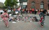 Two Indigenous dancers perform around the 215 pairs of children's shoes placed next to a Sir John A. Macdonald statue in Charlottetown on Monday, May 31, 2021, during a ceremony for the remains of 215 children found at the Kamloops Indian Residential School.THE CANADIAN PRESS/John Morris