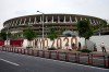 Workers paste the overlay on the wall of the National Stadium, where opening ceremony and many other events are scheduled for the postponed Tokyo 2020 Olympics, Wednesday, June 2, 2021, in Tokyo. THE CANADIAN PRESS/AP/Eugene Hoshiko