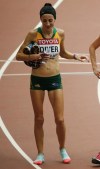 FILE - In this Aug. 30, 2015, file photo, Australia's Sinead Diver reacts after finishing the women's marathon at the World Athletics Championships at the Bird's Nest stadium in Beijing, China. Ireland-born Diver is set to become the oldest athlete to race for Australia in Olympic athletics competition after being among the six marathoners selected for the Tokyo Games.(AP Photo/Mark Schiefelbein, File)