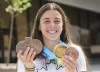 Three-time Olympic medallist Meaghan Benfeito shows off replacement copies of her three lost Olympic medals and two Pan-American Games medals in Montreal on Tuesday, June 8, 2021. The Canadian diver lost her medals along with all her belongings in a devastating fire of her condominium last winter. THE CANADIAN PRESS/Paul Chiasson