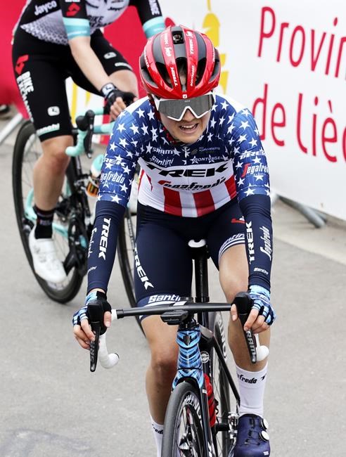 File-This April 21, 2021, file photo shows U.S. rider Ruth Winder of the Trek Segafredo in action during the Women's Belgian cycling classic and UCI World Tour race Fleche Wallonne, in Huy, Belgium. The cycling team that the U.S. is taking to the Tokyo Olympics is a little bit different than the one it would have taken a year ago, when the COVID-19 pandemic forced organizers to postpone the Summer Games by an entire year. In many ways, the team announced Thursday, June 10, 2021, is a whole lot stronger. Chloe Dygert, who sustained a serious injury during a crash last fall, will be busy during the three weeks in Tokyo. The 2019 world time trial champ will join Amber Neben in the race against the clock, and both of them will join Winder, Coryn Rivera and Leah Thomas as the Americans try to upset the heavily favored Dutch in the women's road race. (AP Photo/Olivier Matthys, File)