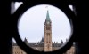 The Parliament Hill Peace Tower is framed in an iron fence on Wellington Street in Ottawa on Thursday, March 12, 2020. After weeks of virtual hearings and often heated debate, an extensively amended Bill C-10 will go back to the House of Commons for a final vote. THE CANADIAN PRESS/Sean Kilpatrick