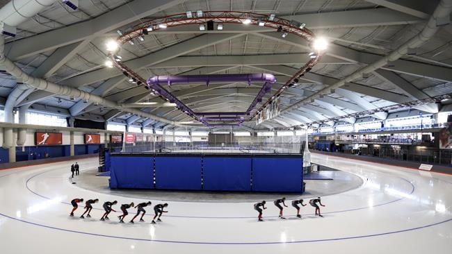 Canadian national long track speed skating team members train on the ice at the Olympic Oval in Calgary, Alta., Friday, June 11, 2021. After almost nine months without ice in the Olympic Oval because of a mechanical failure, Canada's long-track speed skating team started training again on reinstalled ice in their national training centre with an eye on making up ground for the 2022 Winter Olympics in Beijing. THE CANADIAN PRESS/Jeff McIntosh