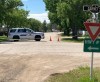 A police vehicle is shown on a street in Wolseley, Sask., Saturday, June 12, 2021. RCMP say an officer died tragically while on duty early Saturday, and that the death is related to an investigation in the communities of Wolseley and Francis, east of Regina. THE CANADIAN PRESS/HO-Tim Taylor MANDATORY CREDIT