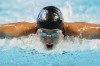 Torri Huske participates in the Women's 100 Butterfly during wave 2 of the U.S. Olympic Swim Trials on Sunday, June 13, 2021, in Omaha, Neb. (AP Photo/Charlie Neibergall)